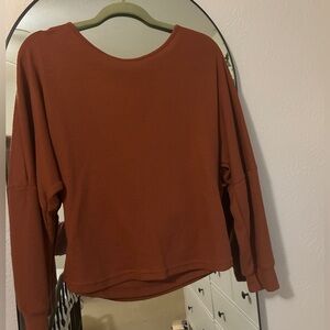 Burnt orange open back light weight sweater. Size large.